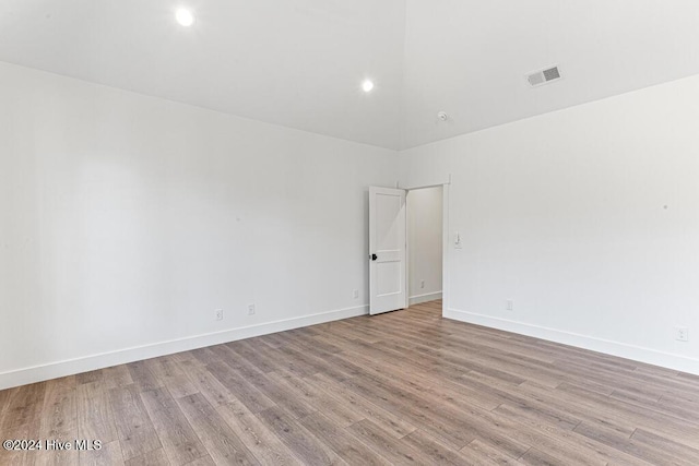 spare room featuring light wood-type flooring