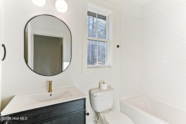 full bathroom featuring vanity, toilet, and tiled shower / bath combo