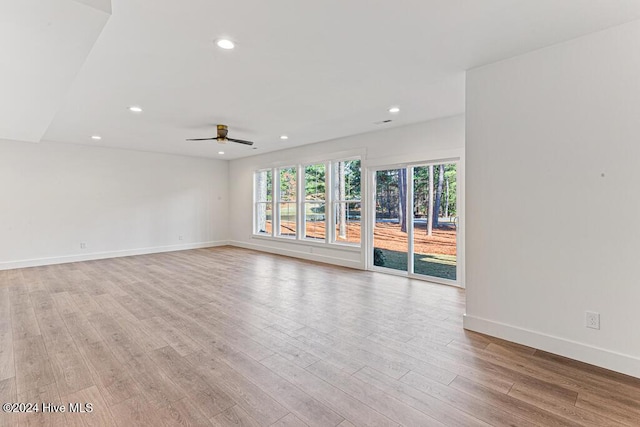 unfurnished room featuring ceiling fan and light hardwood / wood-style floors