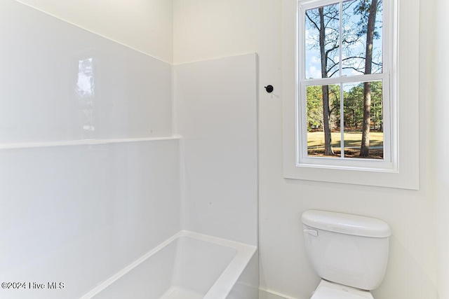 bathroom with separate shower and tub, toilet, and plenty of natural light