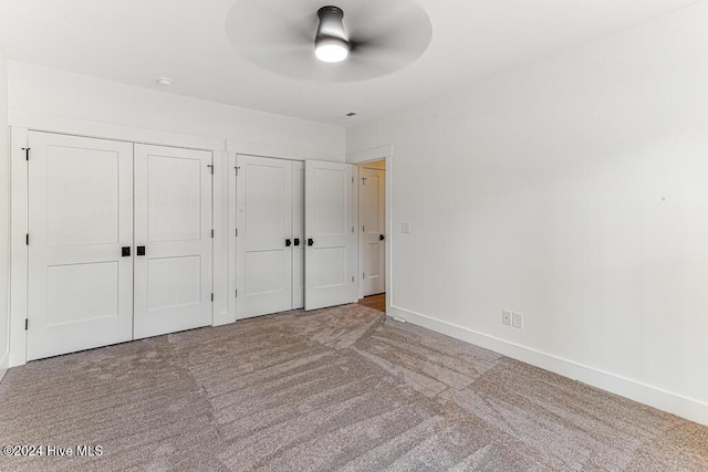 unfurnished bedroom with carpet flooring and ceiling fan