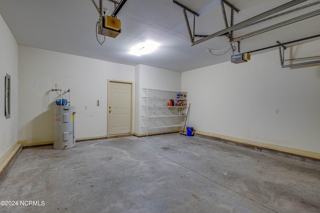 garage with a garage door opener and electric water heater