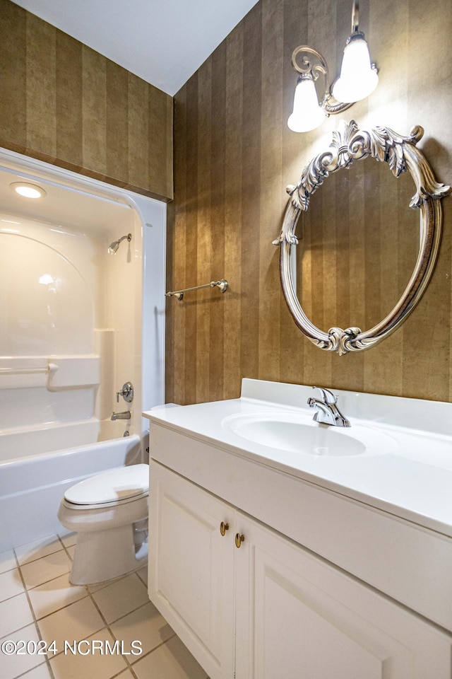 full bathroom featuring shower / washtub combination, tile patterned flooring, vanity, and toilet