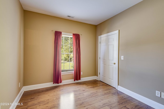 empty room with light wood-type flooring