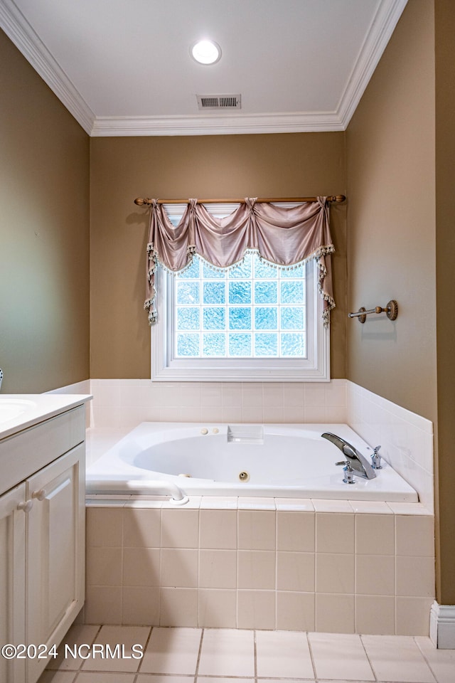 bathroom with ornamental molding, vanity, tile patterned floors, and a relaxing tiled tub