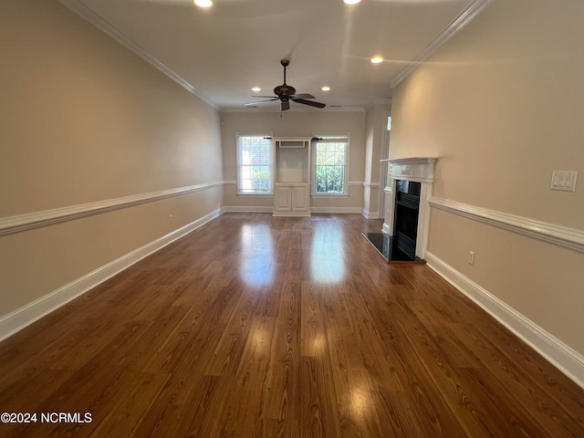 unfurnished living room featuring ceiling fan, dark hardwood / wood-style floors, and ornamental molding