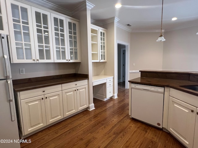 kitchen featuring pendant lighting, dishwasher, dark wood-type flooring, white cabinetry, and crown molding