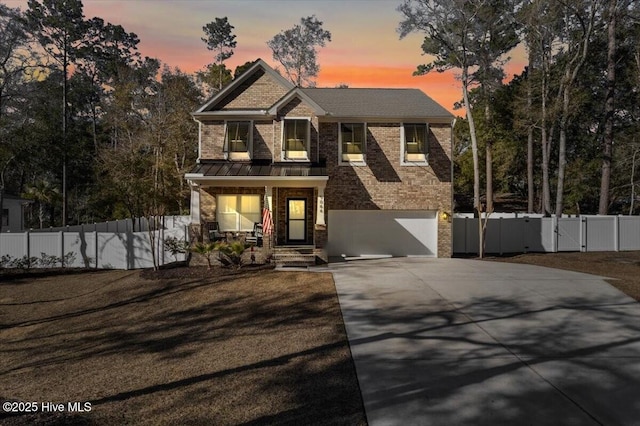 craftsman-style house featuring a garage and covered porch