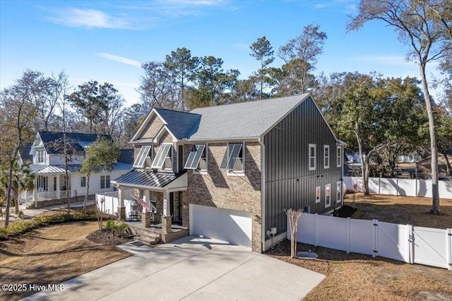 view of front of house with a porch and a garage