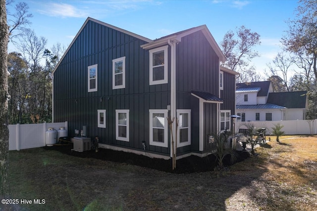 view of side of property with cooling unit