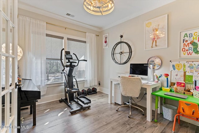 office space featuring ornamental molding, hardwood / wood-style floors, and french doors