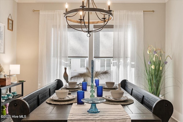 dining space with a chandelier