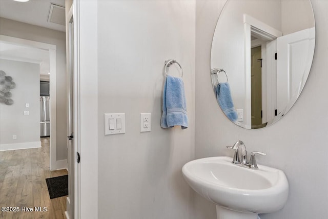 bathroom with sink and hardwood / wood-style floors