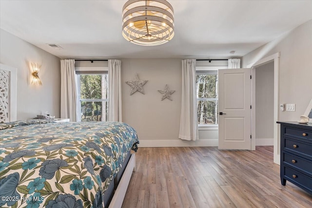 bedroom with light wood-type flooring