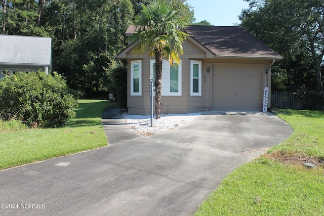 view of front facade featuring a garage and a front yard