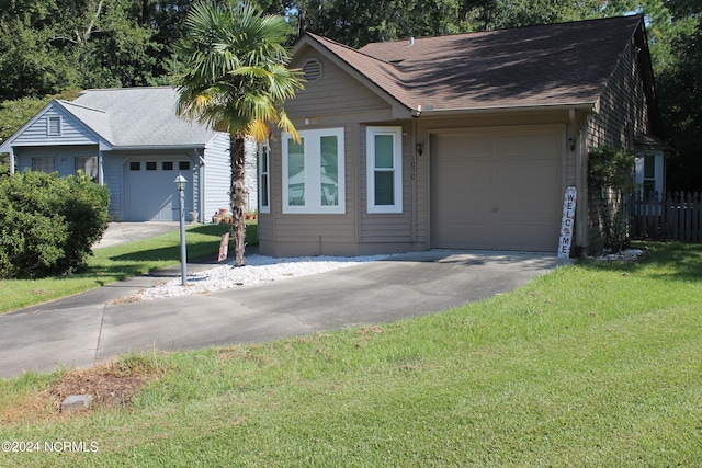 ranch-style home with a front yard and a garage