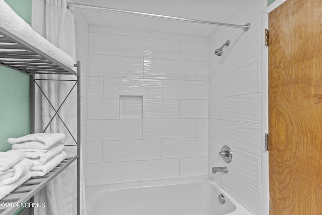 bathroom with shower / bath combo