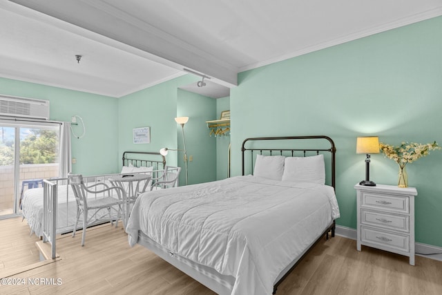 bedroom featuring light hardwood / wood-style floors and ornamental molding