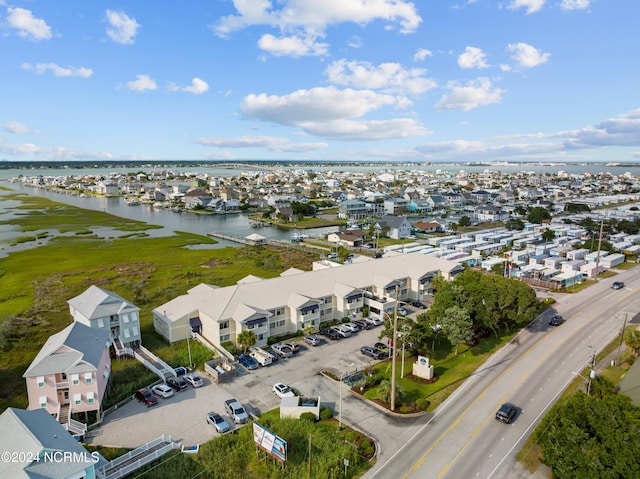 birds eye view of property featuring a residential view and a water view