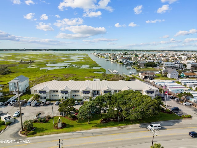 birds eye view of property featuring a water view and a residential view