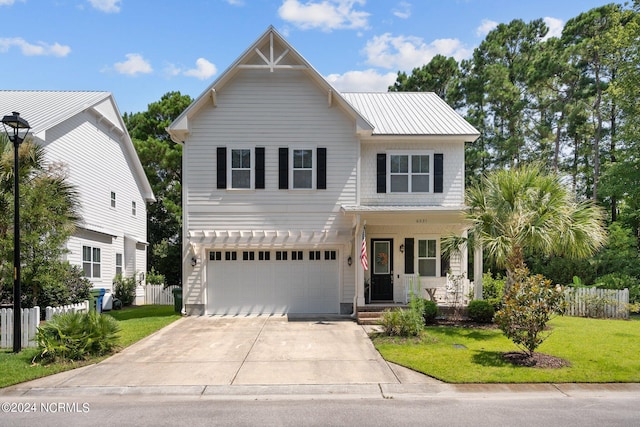 view of front of house featuring a garage, a porch, and a front lawn