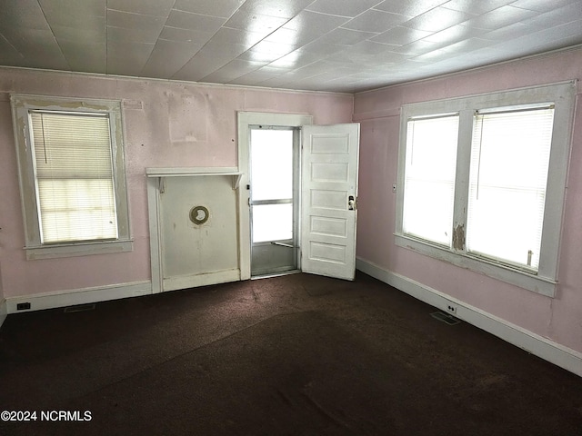 interior space with dark colored carpet