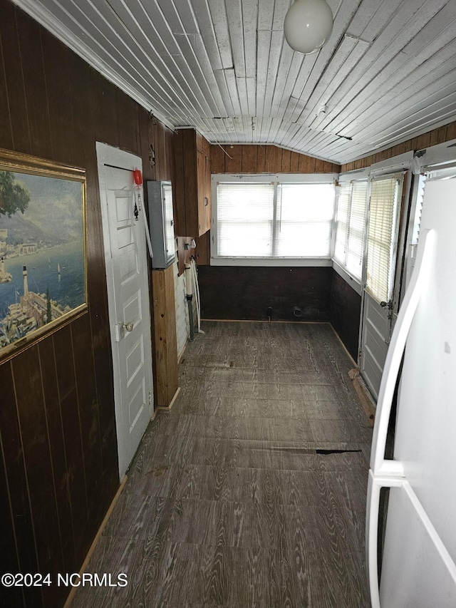 unfurnished sunroom featuring vaulted ceiling and wooden ceiling