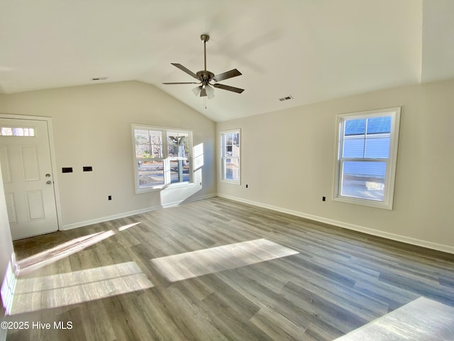 exercise area with lofted ceiling and hardwood / wood-style floors