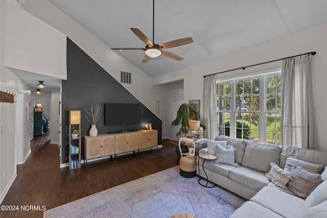 living room featuring high vaulted ceiling, ceiling fan, and dark wood-type flooring