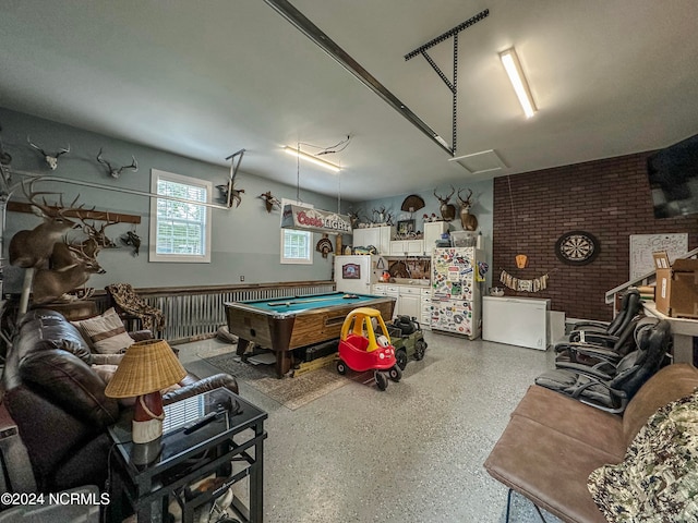 game room featuring brick wall and pool table