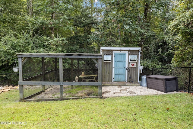 view of outbuilding featuring a lawn