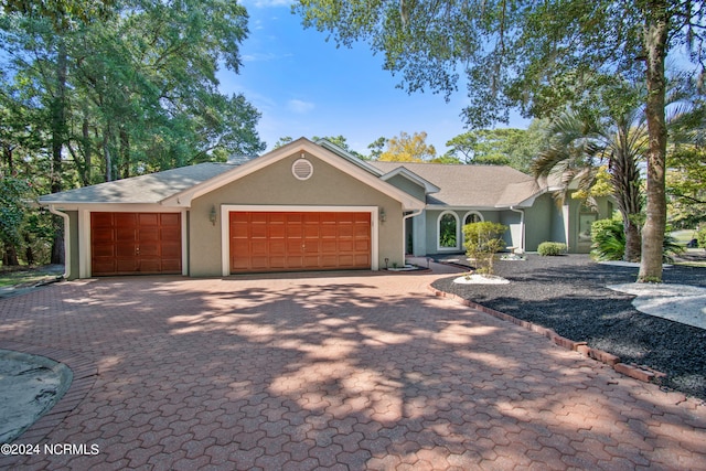 single story home with a garage