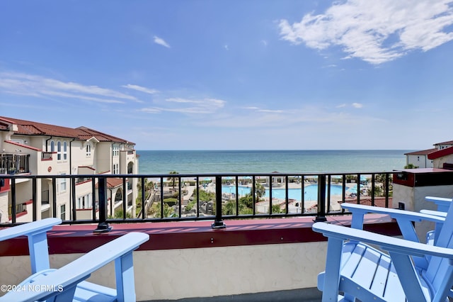 balcony featuring a water view