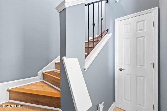 stairway featuring baseboards