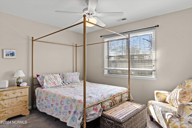 bedroom with carpet, visible vents, and a ceiling fan