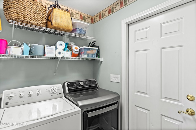 washroom featuring laundry area and washer and clothes dryer