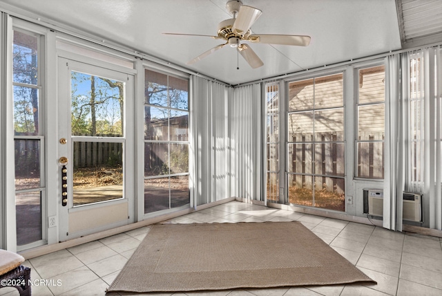 unfurnished sunroom featuring ceiling fan