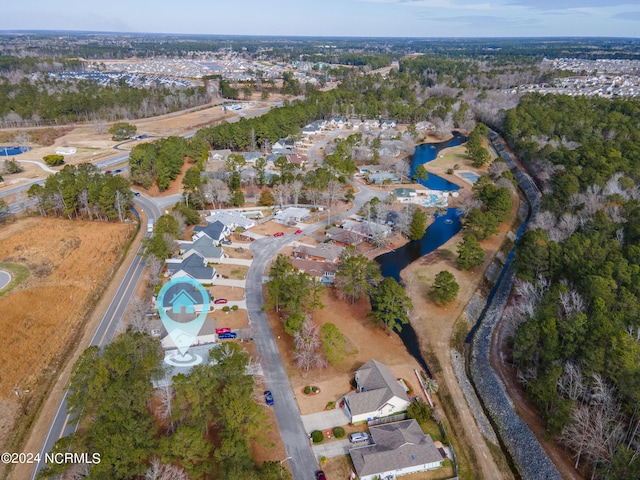 birds eye view of property with a water view and a residential view