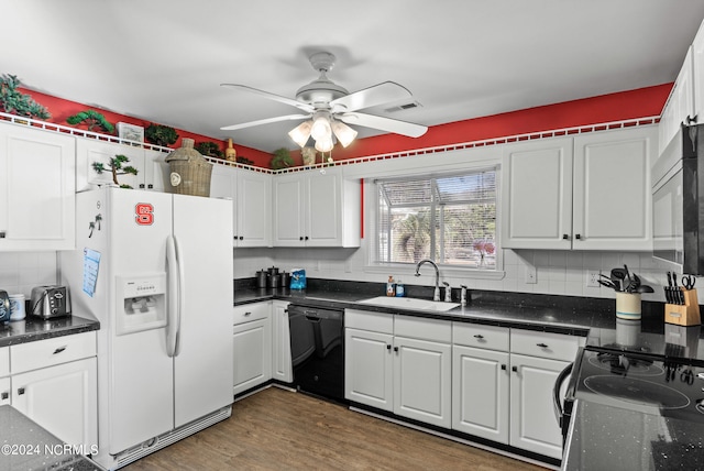 kitchen featuring black appliances, visible vents, white cabinets, and a sink