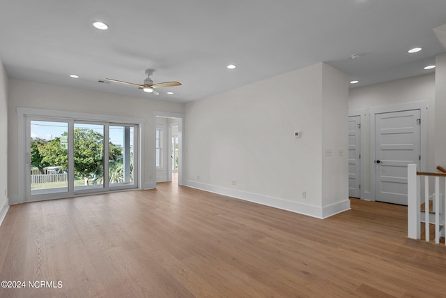 spare room featuring light wood-type flooring and ceiling fan