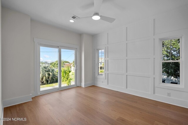 spare room with ceiling fan and hardwood / wood-style floors