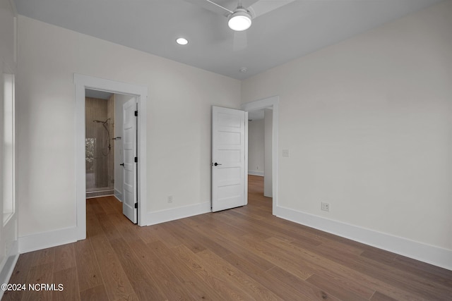 unfurnished bedroom featuring a ceiling fan, baseboards, and wood finished floors