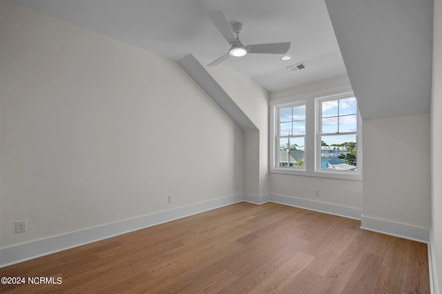 additional living space with ceiling fan, lofted ceiling, and light hardwood / wood-style floors