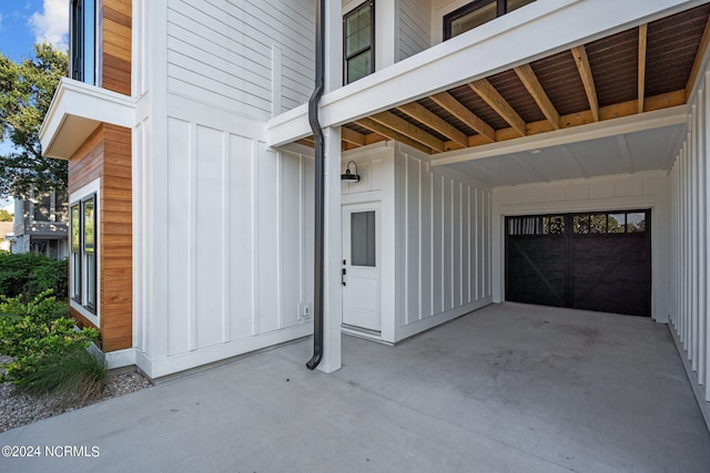 exterior space featuring a garage and board and batten siding