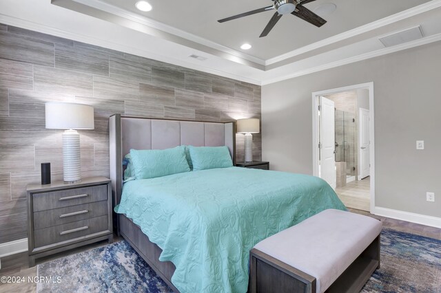 bedroom with ensuite bath, tile walls, ornamental molding, and ceiling fan