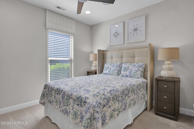 carpeted bedroom with ceiling fan