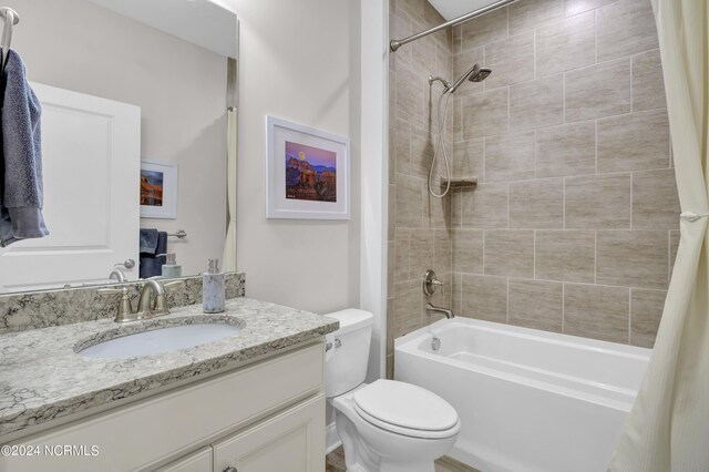 full bathroom featuring vanity, toilet, and shower / bath combo with shower curtain