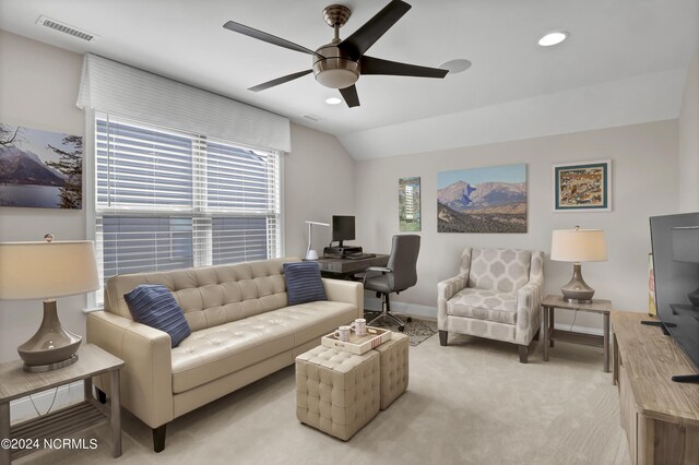 carpeted living room featuring lofted ceiling, a healthy amount of sunlight, and ceiling fan