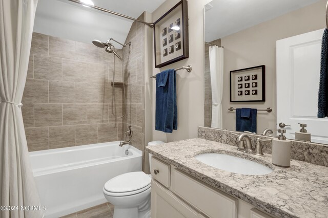 full bathroom featuring vanity, toilet, and shower / bath combo