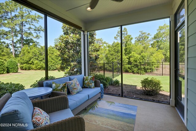 sunroom / solarium featuring ceiling fan and a healthy amount of sunlight